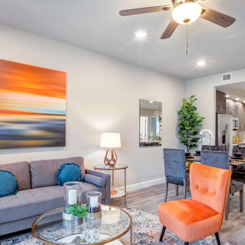 Ceiling fans throughout Ceiling fan and light fixtures in apartment living rooms at The Reef at Winkler