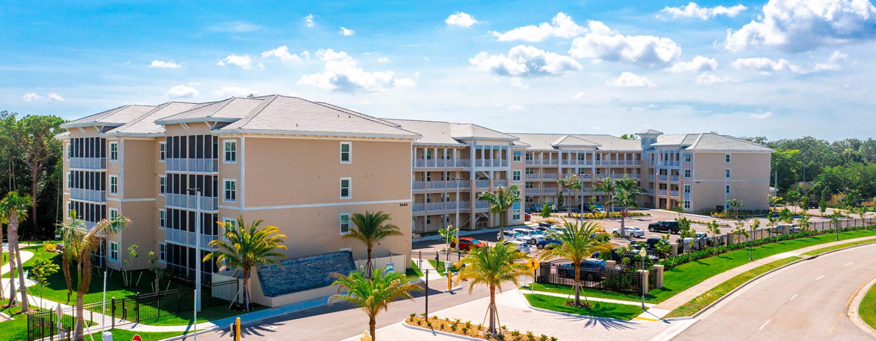 Exterior view of The Reef at Winkler showcasing controlled entry gates with cameras and recognition technology